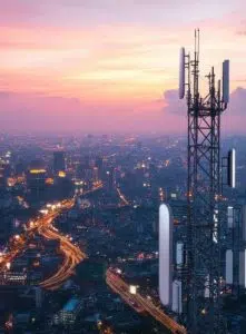 broadband tower with skyline at sunset image