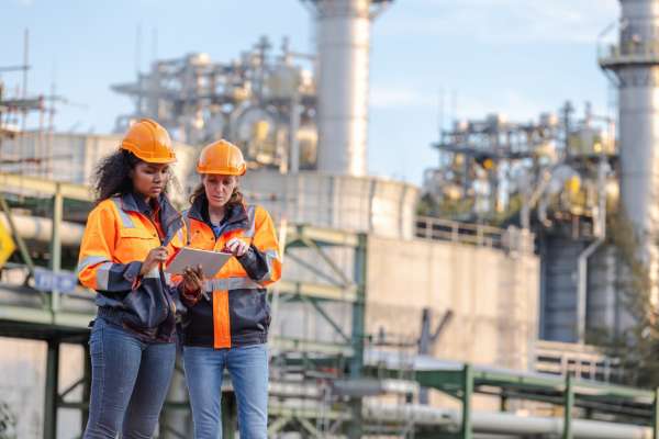 Women on utilities site looking at tablet image