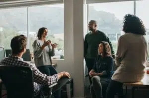 people in meeting room casually talking image